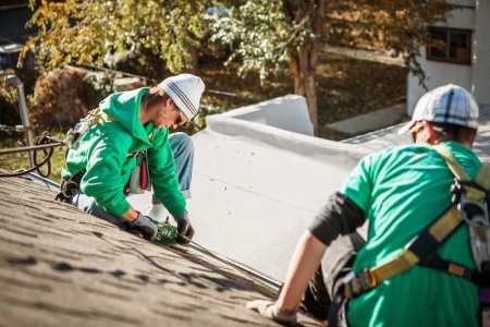 solar-panel-installation-crew-members-on-roof-of-h-2024-11-03-04-48-58-utc.jpg
